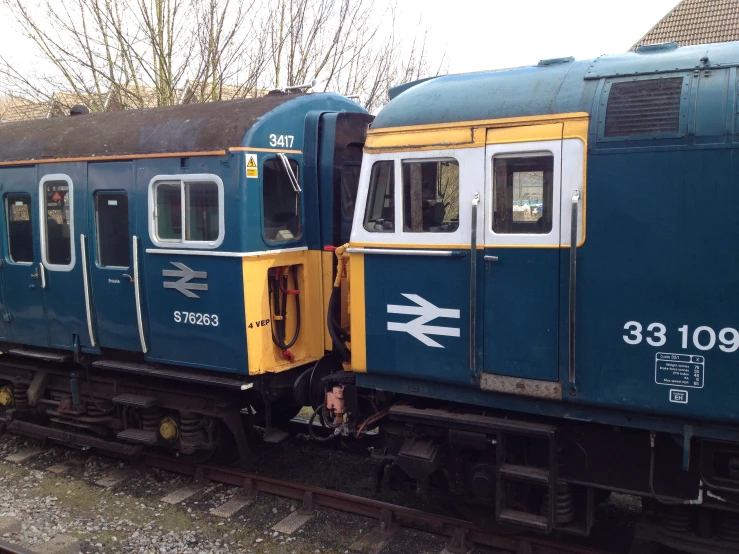 the back end of a blue passenger train