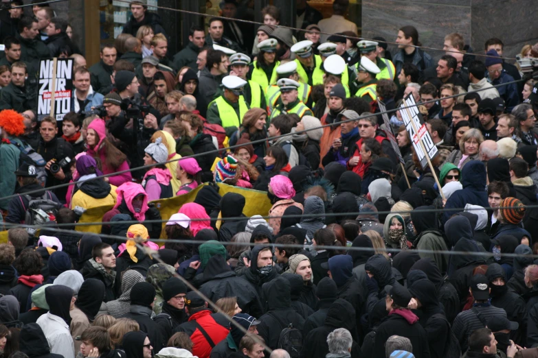 people standing in the streets in yellow vests