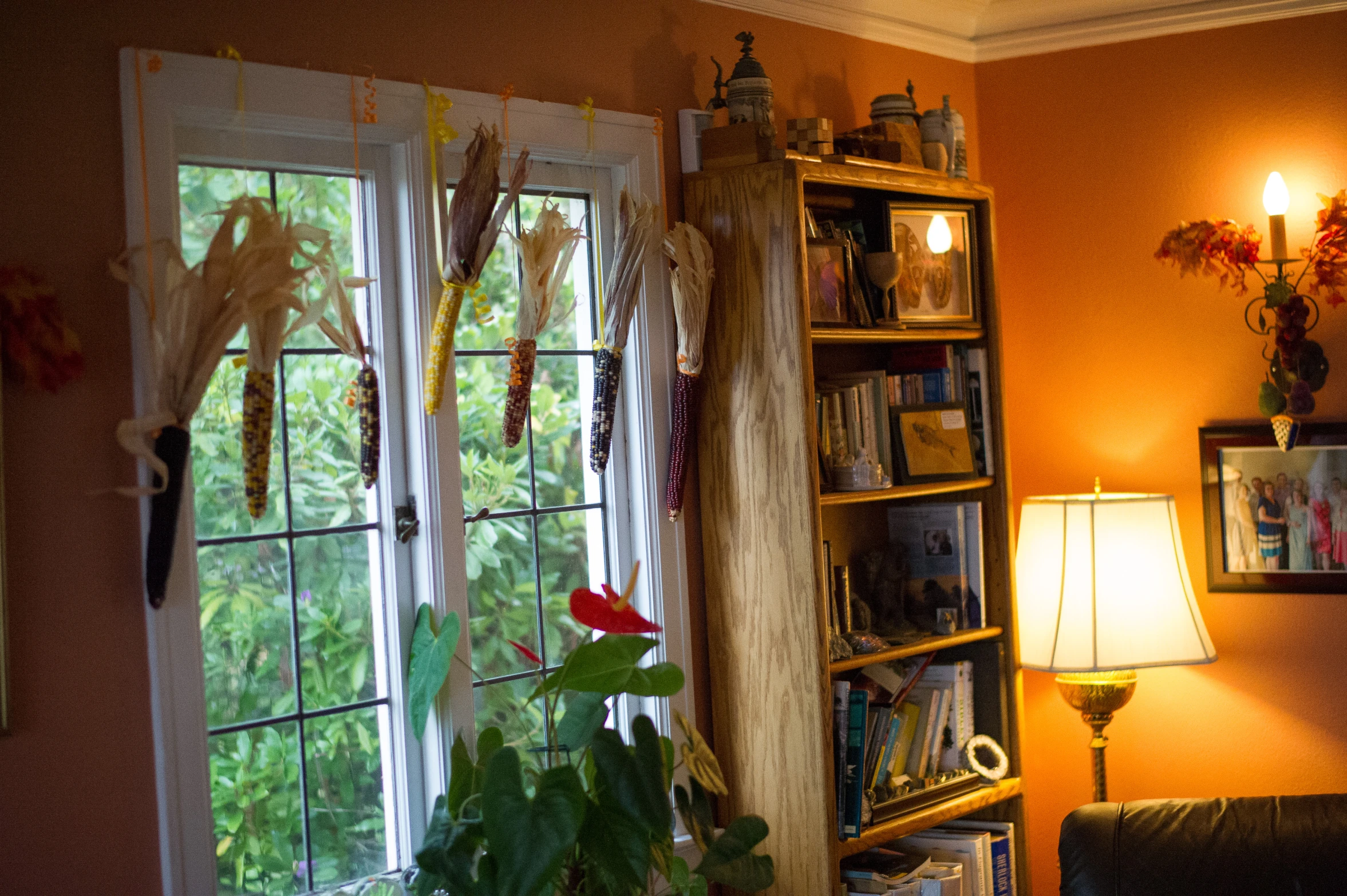 living room with yellow walls and white curtains