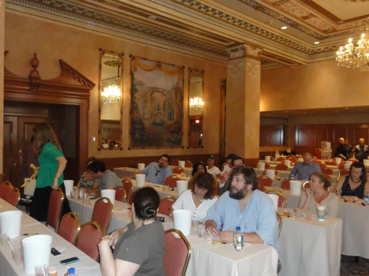 people are sitting down to a small group of dining