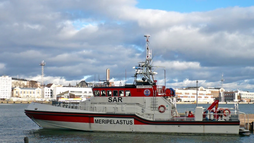 there is a large white and red boat on water