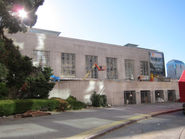 a fire hydrant is in front of the cement building