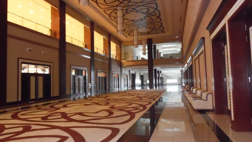 a fancyly designed lobby leads to a large open space