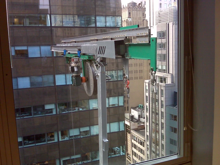 a view from inside a window, showing buildings and city