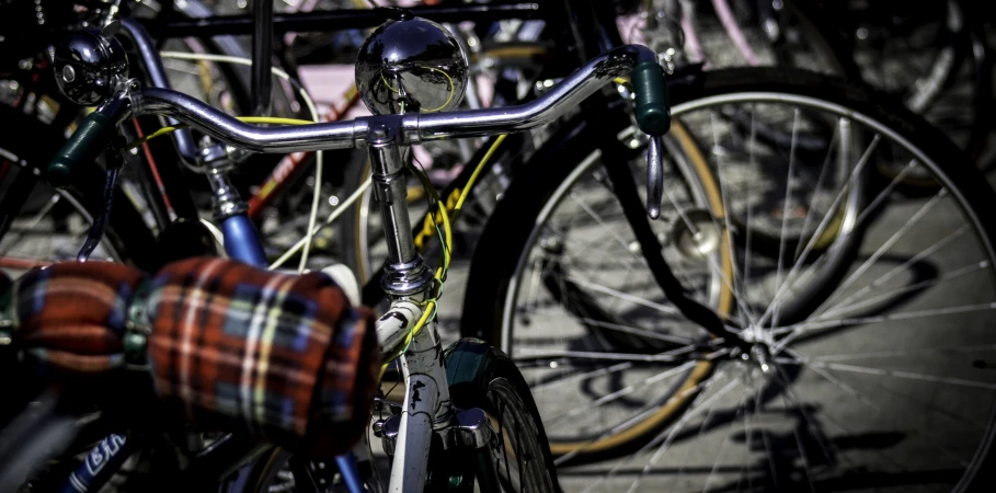 a close up of a bicycle with a rack in the background