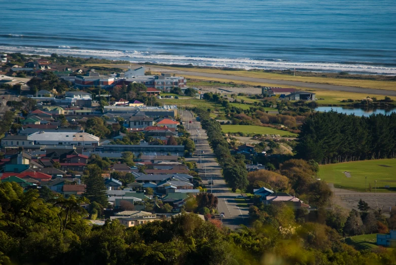 an aerial view of houses near the beach