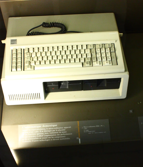 a computer keyboard on a table in an exhibit