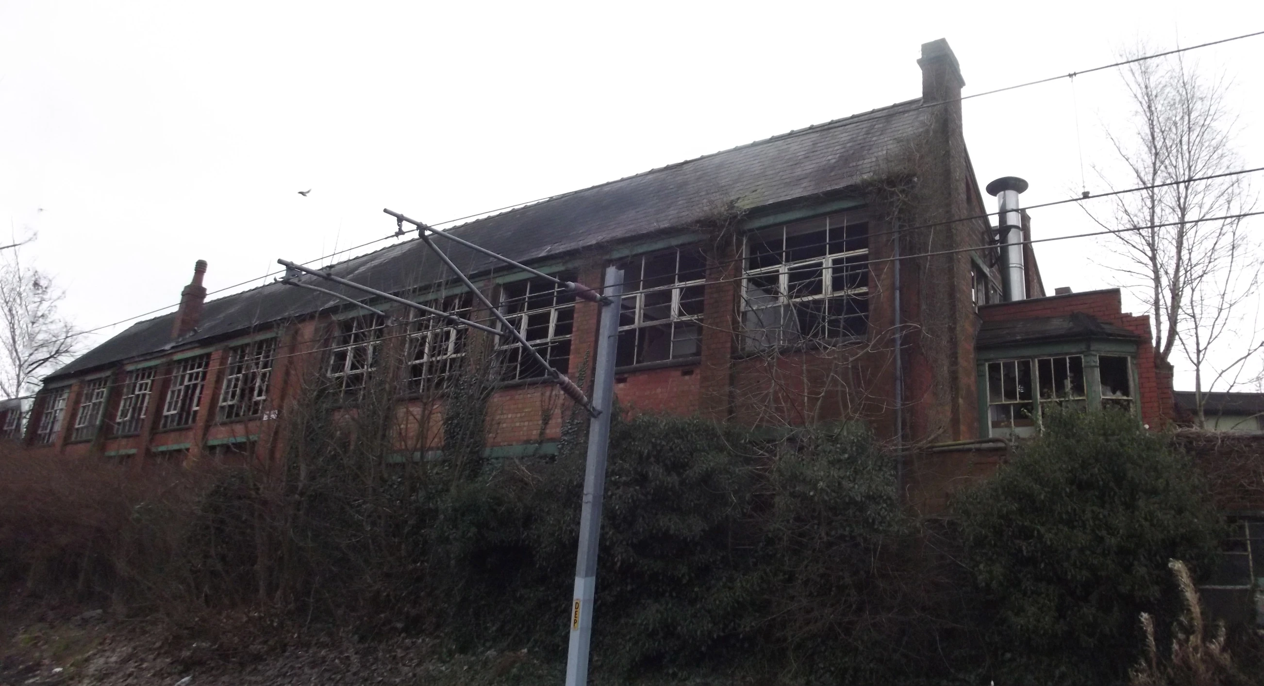 a very old red brick house in the country