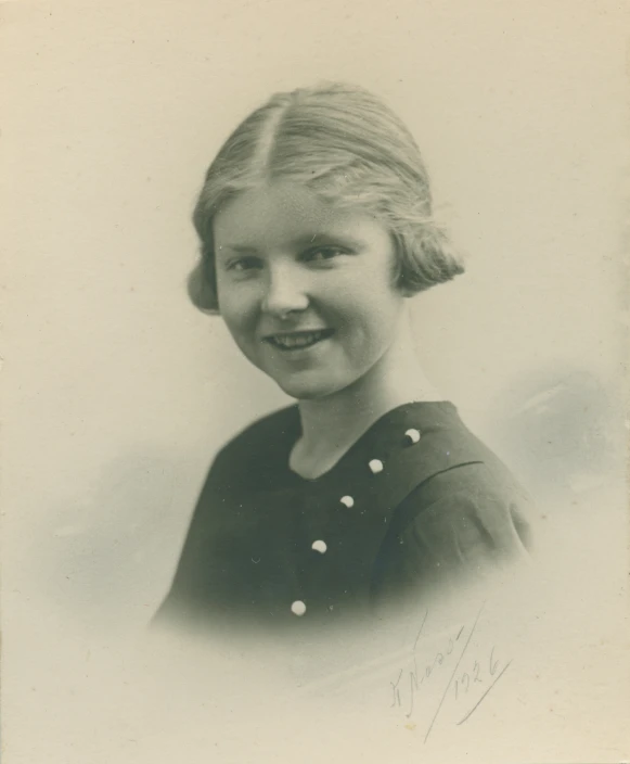 a black and white po of a smiling woman