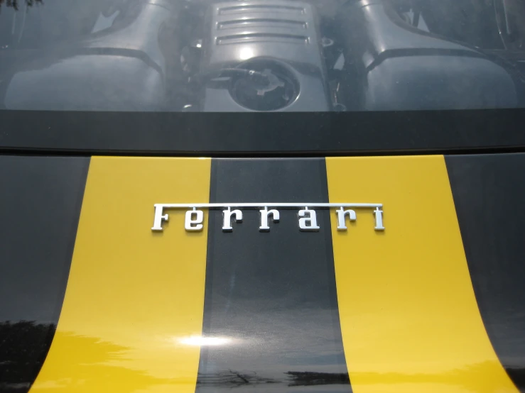 the hood of a car that has the ferrari logo on it