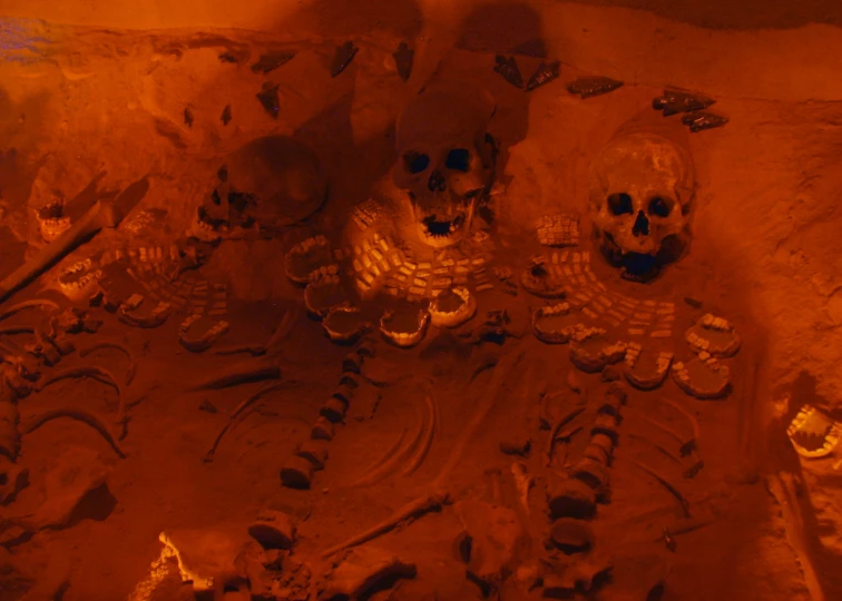 an image of skull art with orange glow
