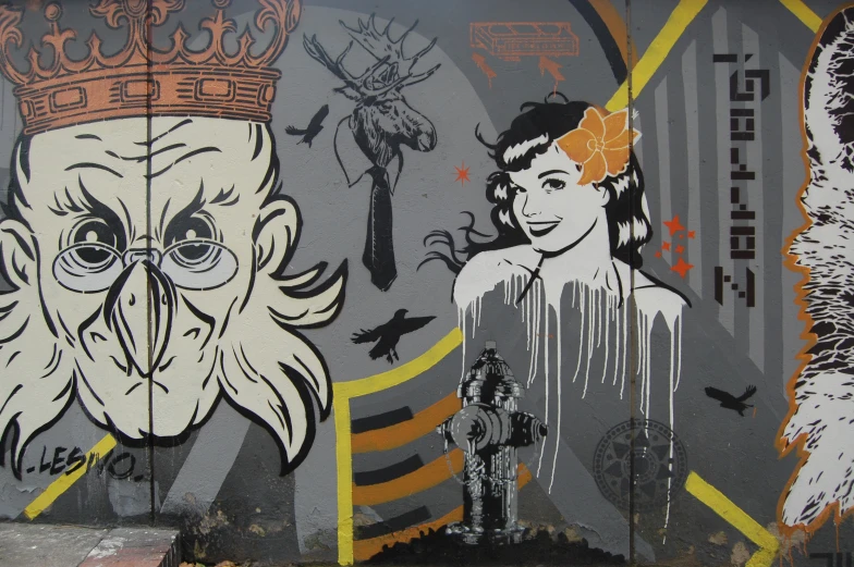 a large grafitti depicting an old woman and a man