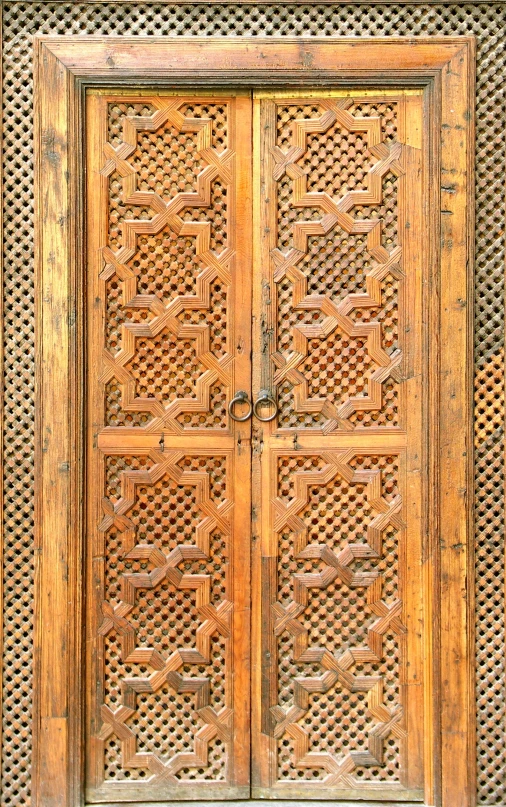 an intricate wooden door frame with iron work