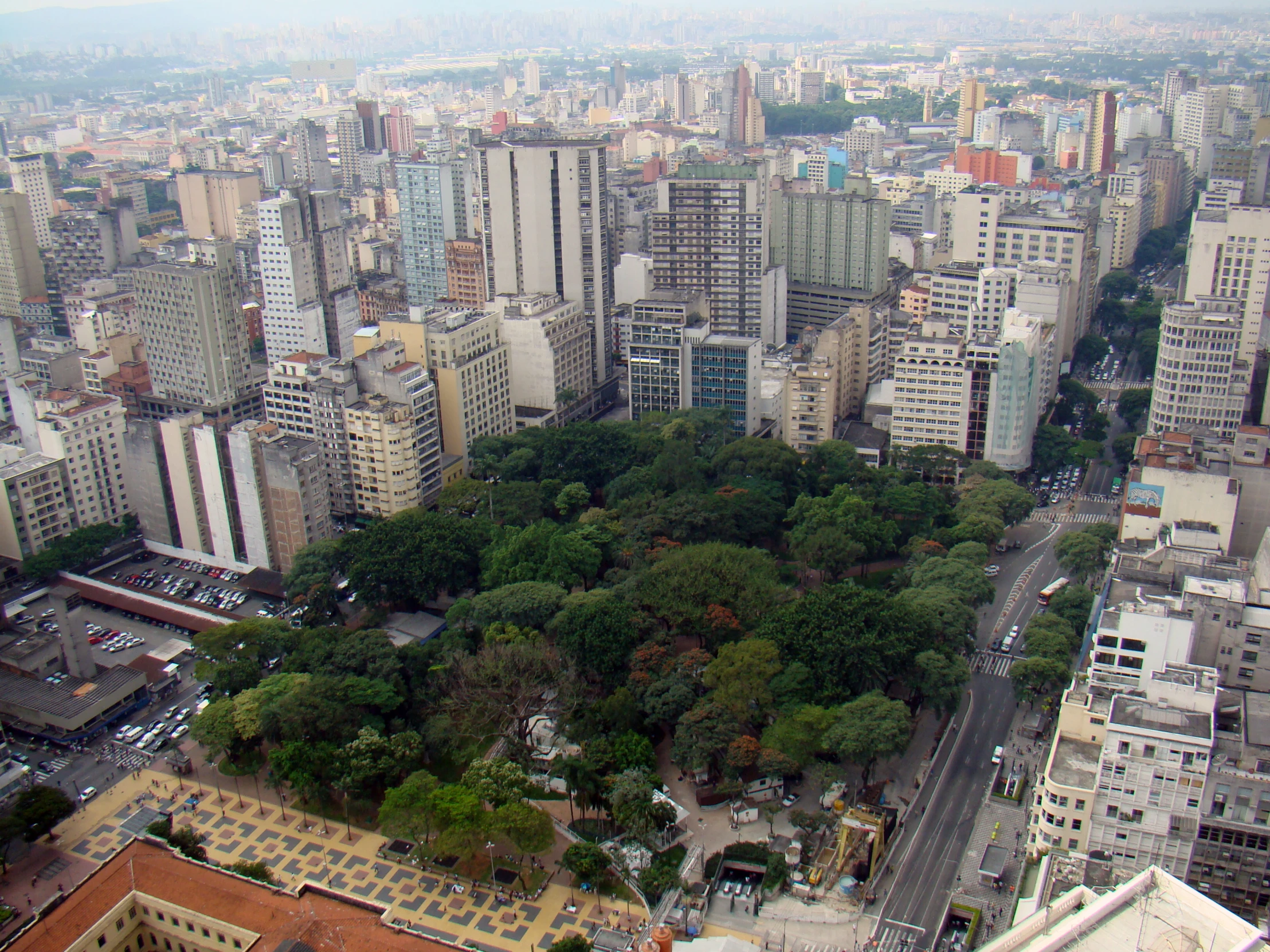 an aerial view of tall buildings and trees