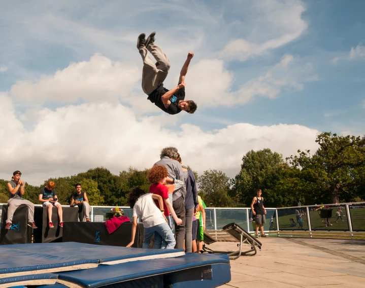 a man on a skateboard doing tricks in the air