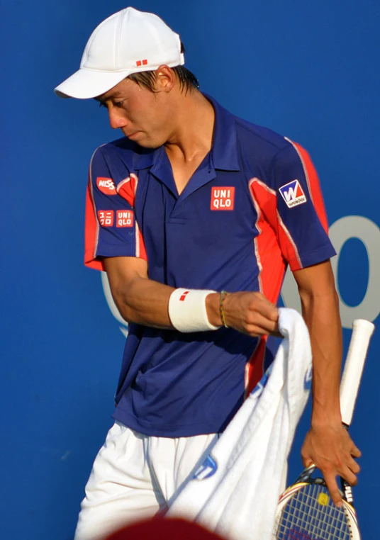 the tennis player in blue has a white cap