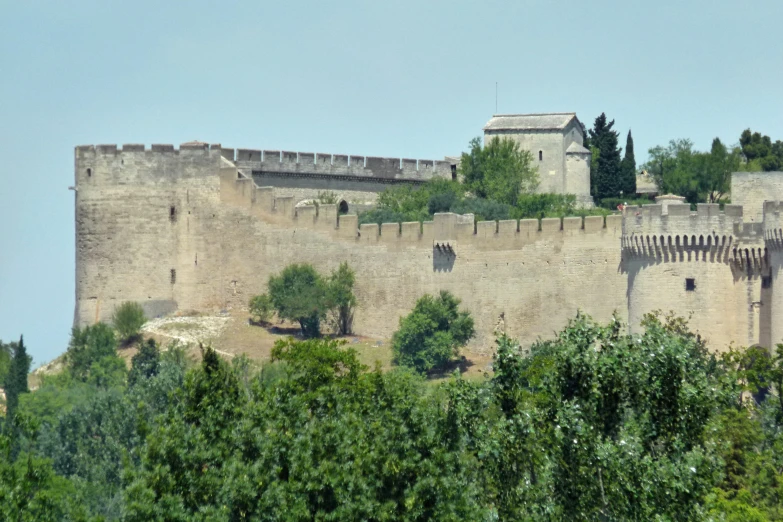 an old castle built into the side of a hill