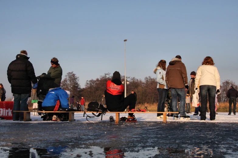 a group of people hanging out on some ice