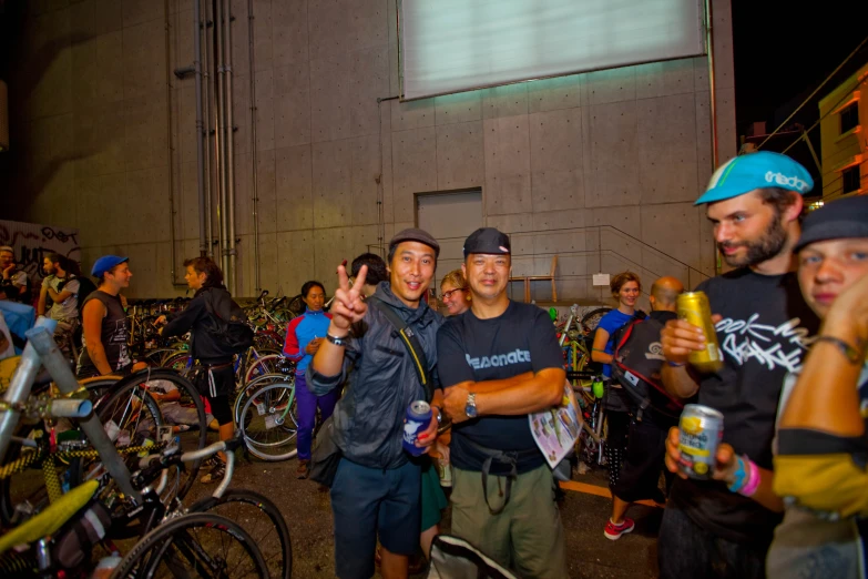 people standing on a street with bikes and bicycles