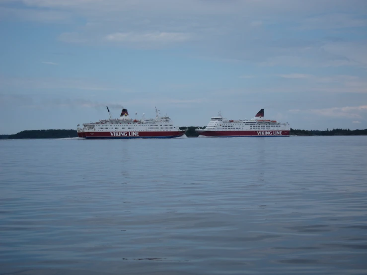 two ships docked in a large body of water