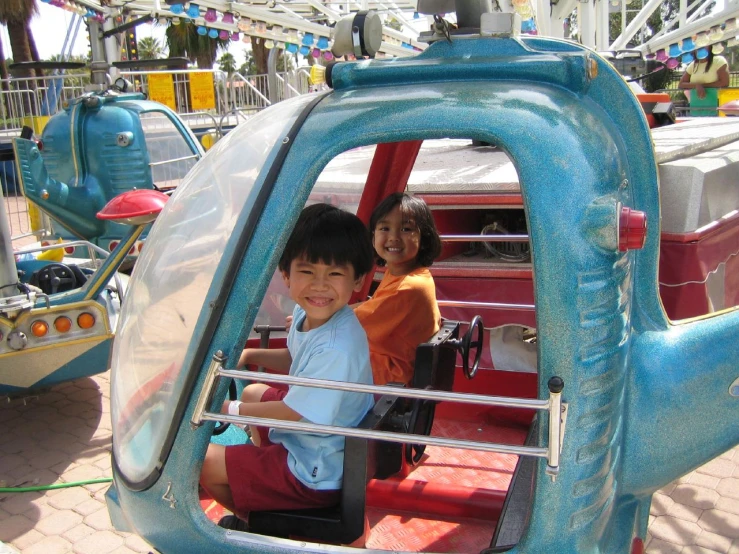 a  riding in a blue vehicle