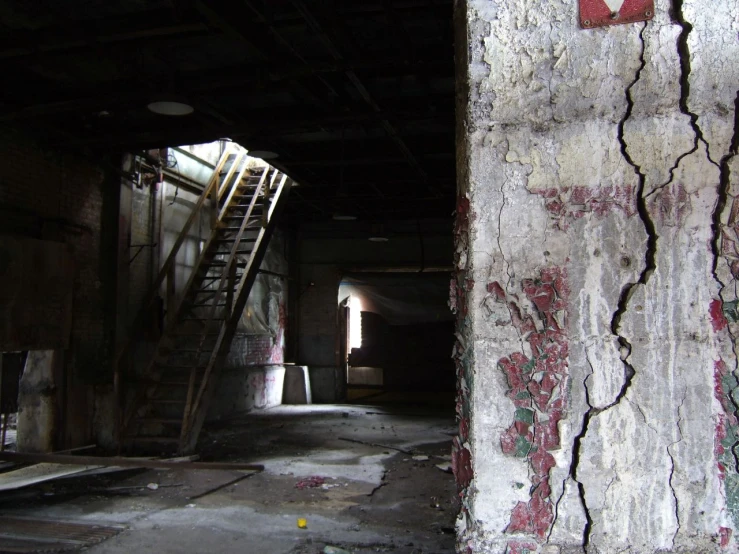 the stairway leading to the entrance is covered with graffiti