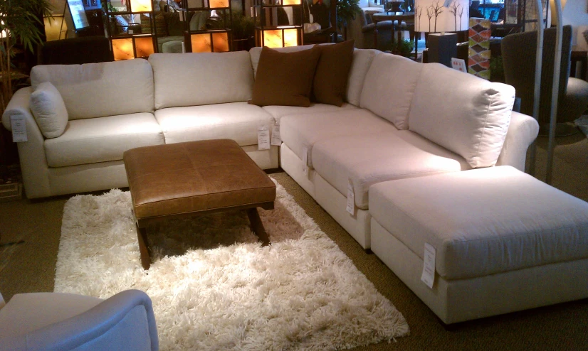 a white couch is in a living room