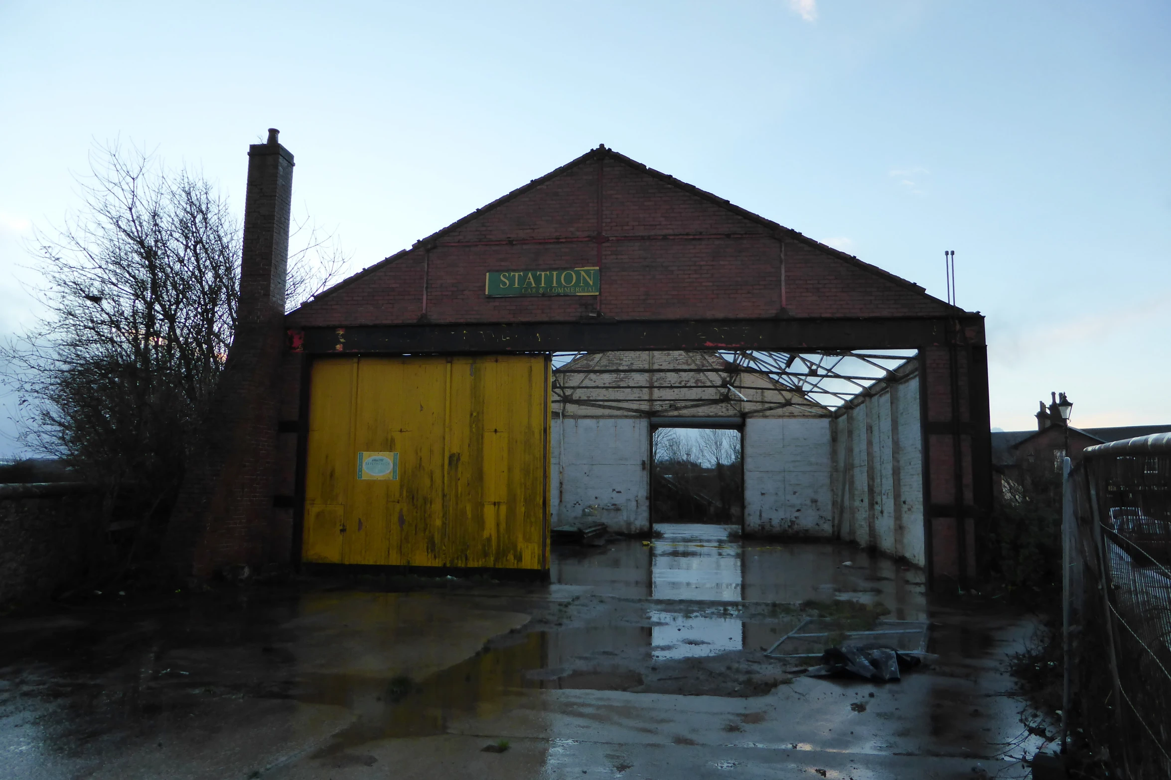 there is a yellow door leading to a building