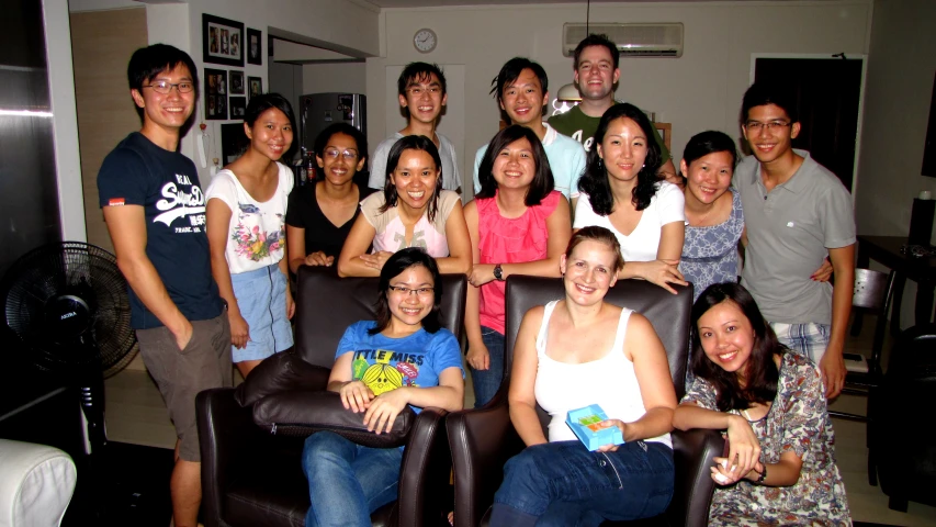 an image of a family of people with glasses on posing for the camera