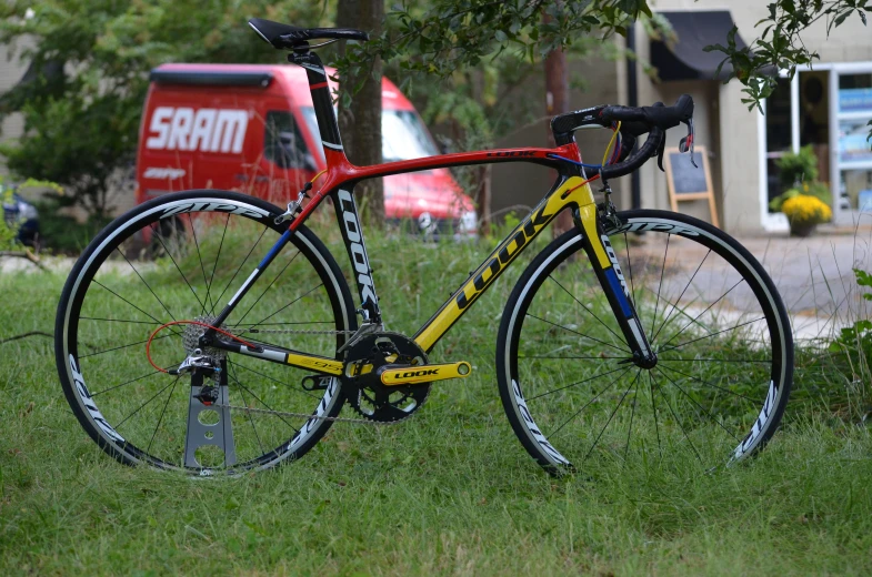 a road bike in the grass near trees