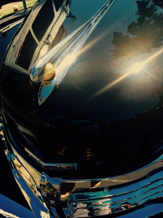 a close up of the hood ornament on a classic car