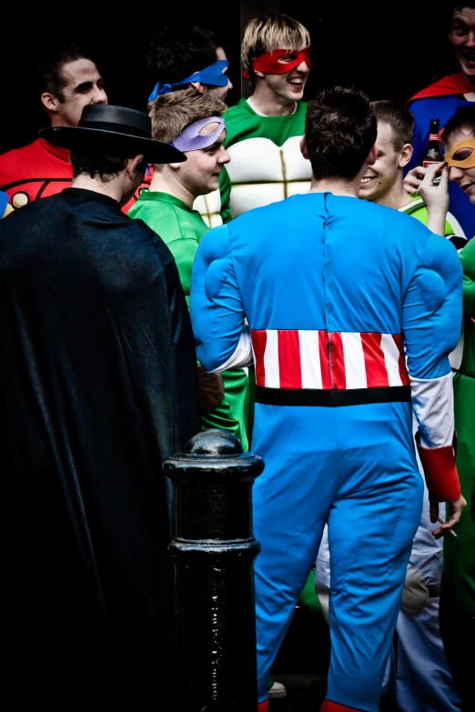 many people are dressed as comic characters