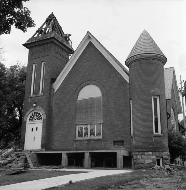 old church building with two towers and a small bell tower