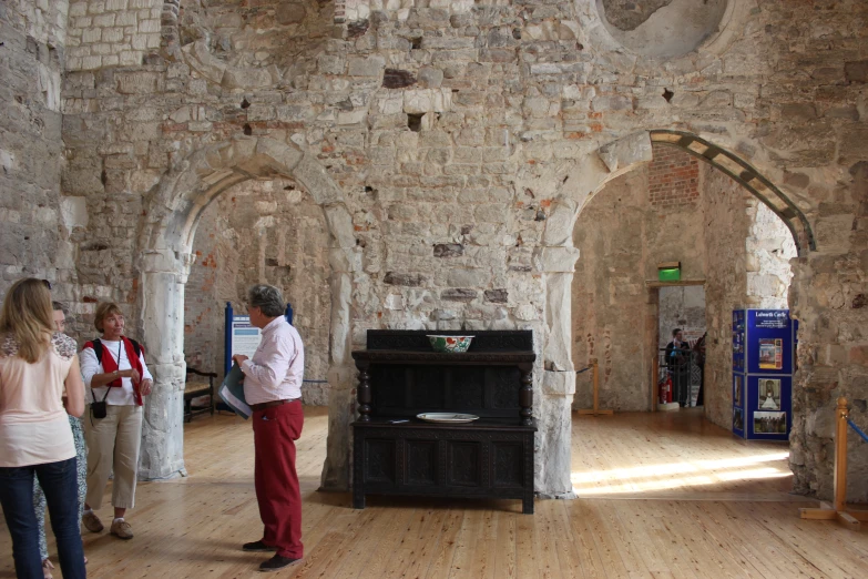 two women are looking at an old piano