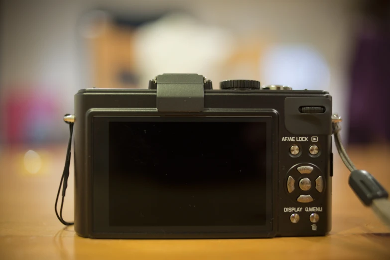 a close - up of an electronic camera with a flash drive plugged into it