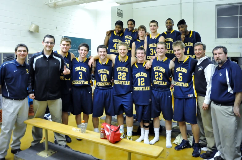 a basketball team posing for a team po together