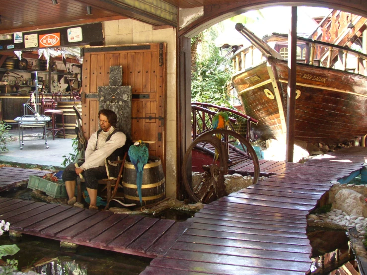 a woman sitting on a stool inside of a store