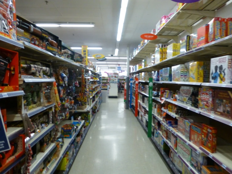 an aisle that is stocked with toys and food