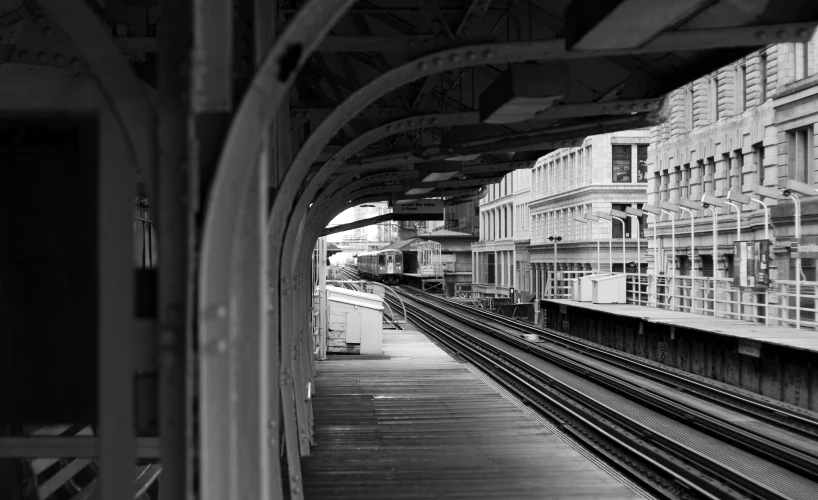 a black and white pograph of a train station