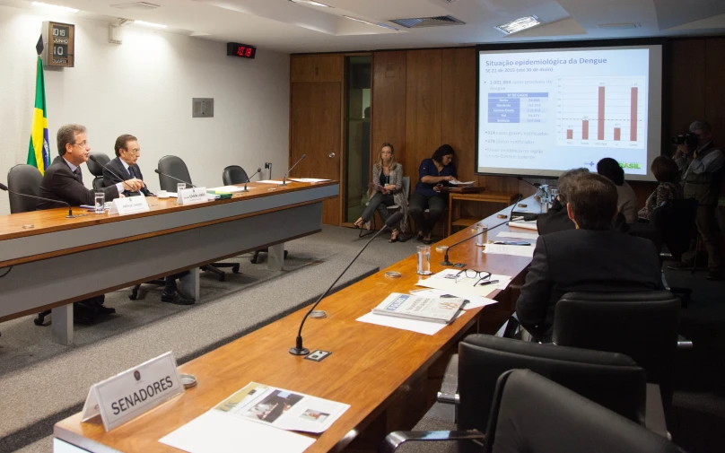 a group of people at a conference table