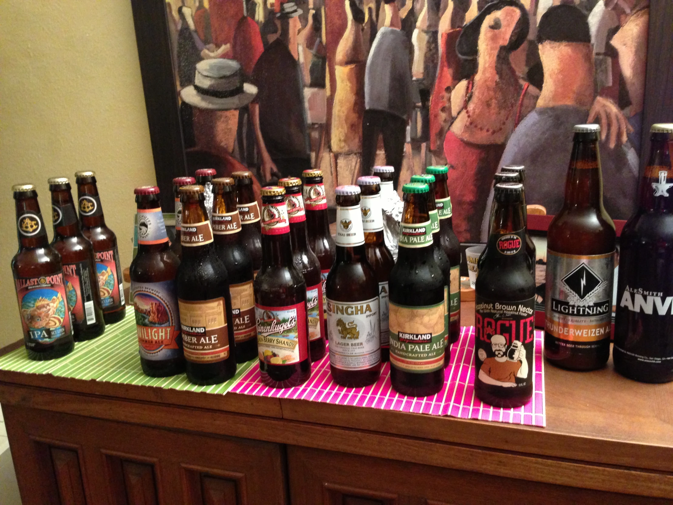 an assortment of beer bottles on a table