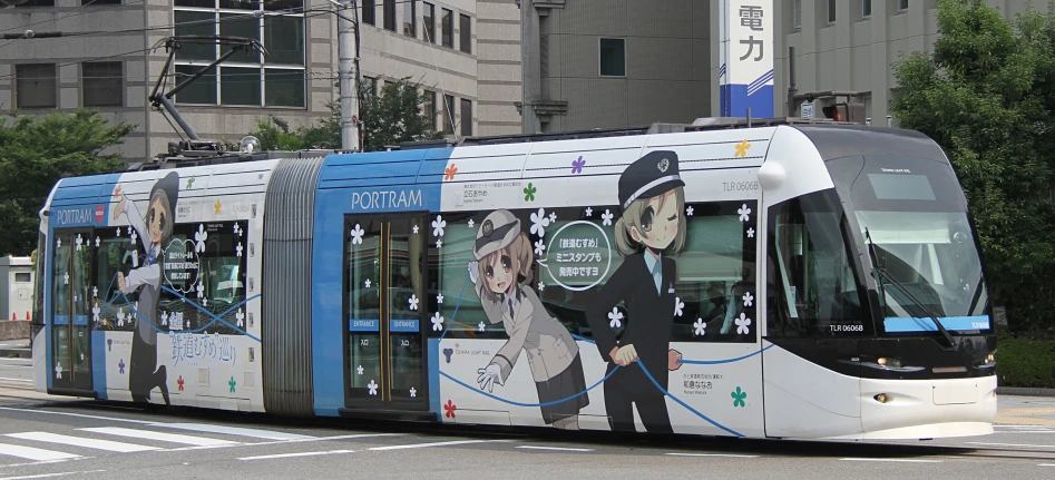 a white and blue passenger bus traveling past tall buildings