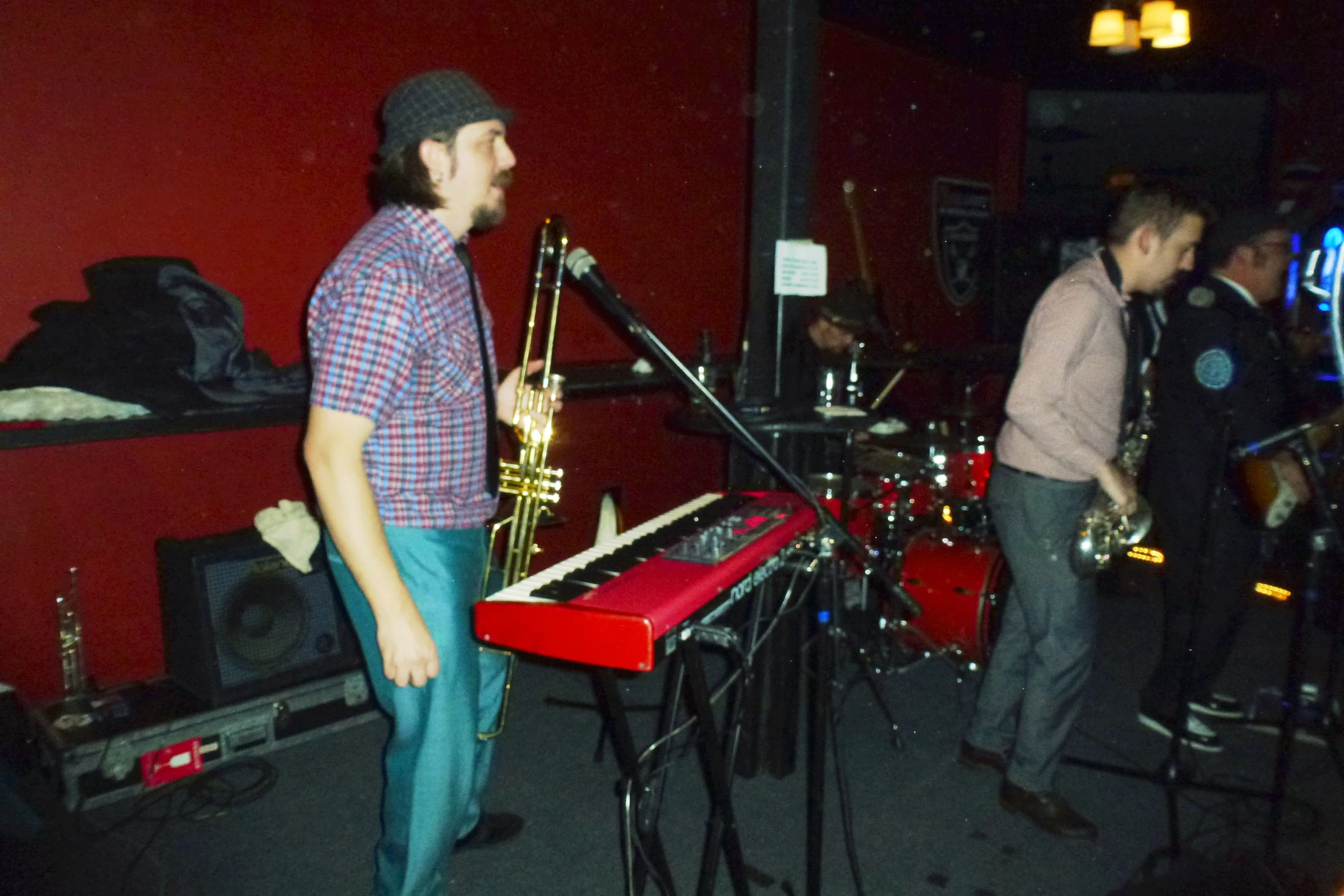 people standing in a room with instruments