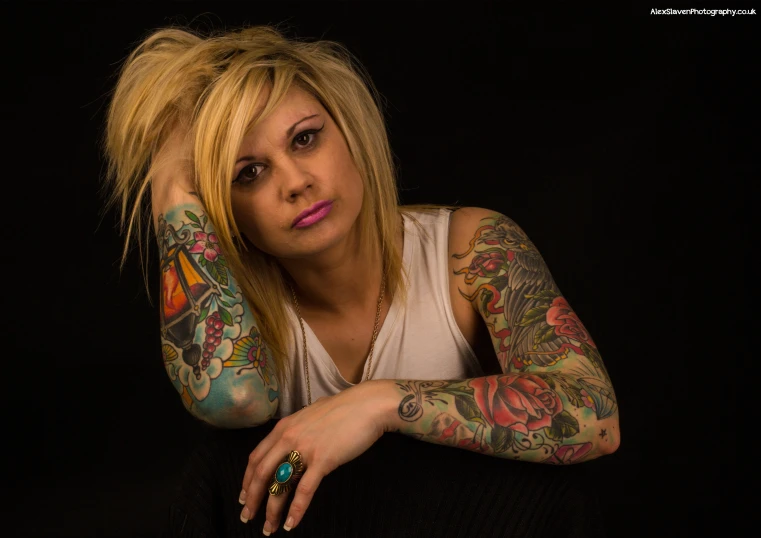 a person with tattoos on her arms and their arm tattoo