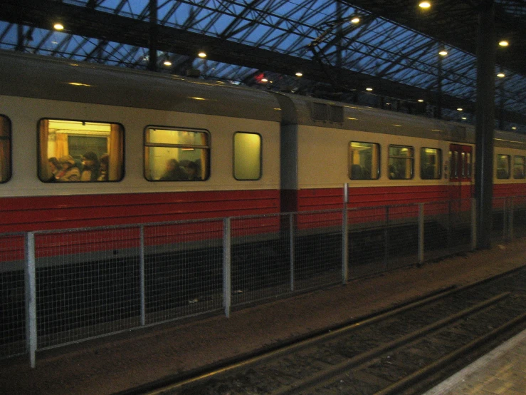 a train on the rails in an enclosed area