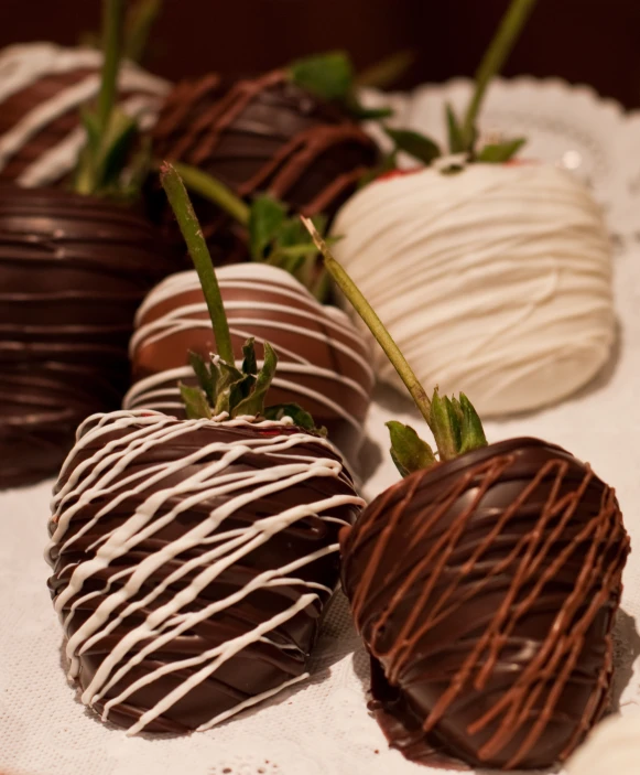 chocolate covered strawberries on a lace doily