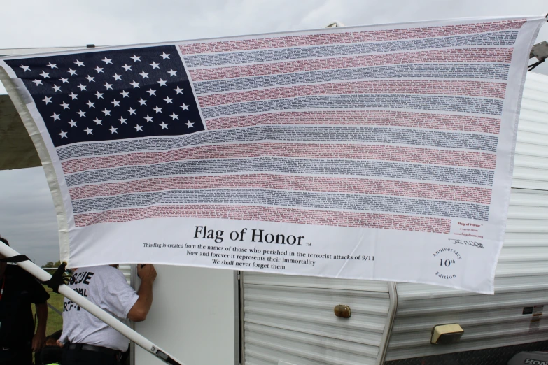 an american flag on display near a trailer