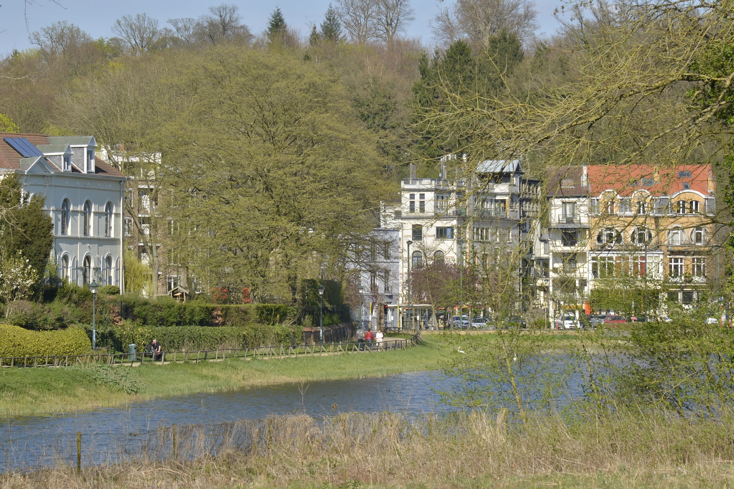 several large building sitting along side a river