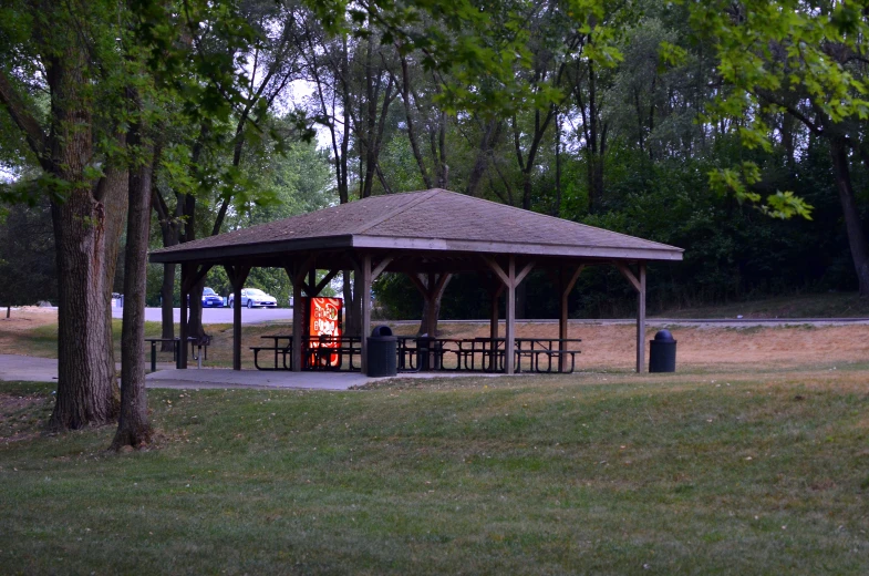 a small structure in a large green grass field