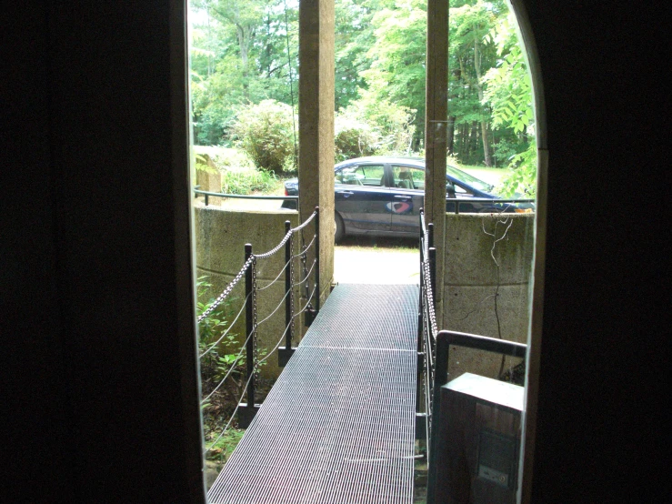 a car is in the driveway through a window